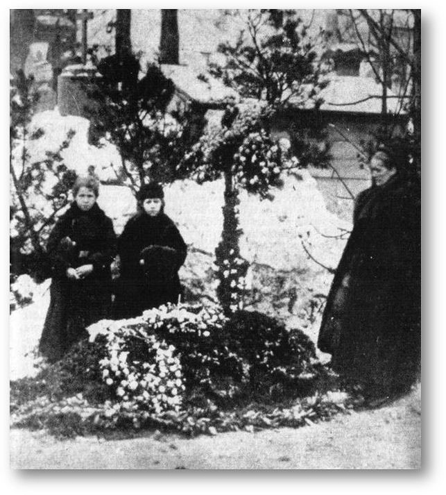 Dostojevskaja med sine barn Fedja og Ljubow ved hennes ektemanns grav.